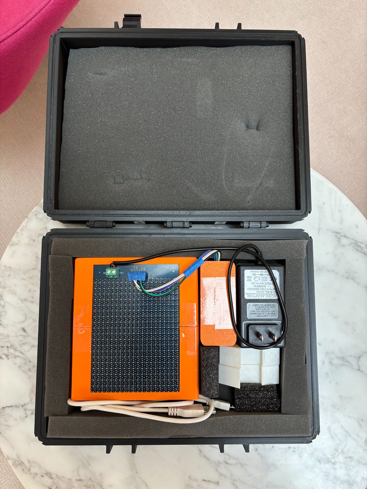 Complete 1-bit mmWave RIS product package with RIS panel, power adapter and accessories